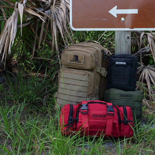 Four tactical bags in various colors and sizes.